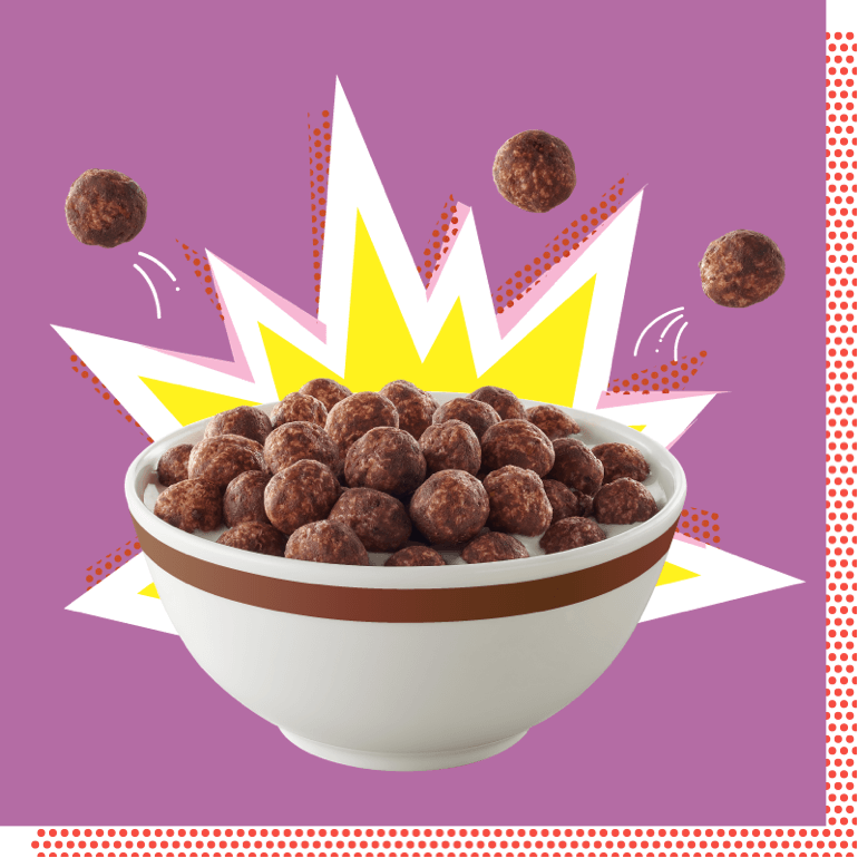 a bowl of Wonder Works keto friendly chocolate cereal with a comic book style explosion behind it.